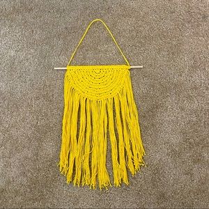 Yellow macramé wall hanging